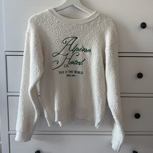 Universal Thread Alpine Hotel Top of the World Cream Sweater with Green Text